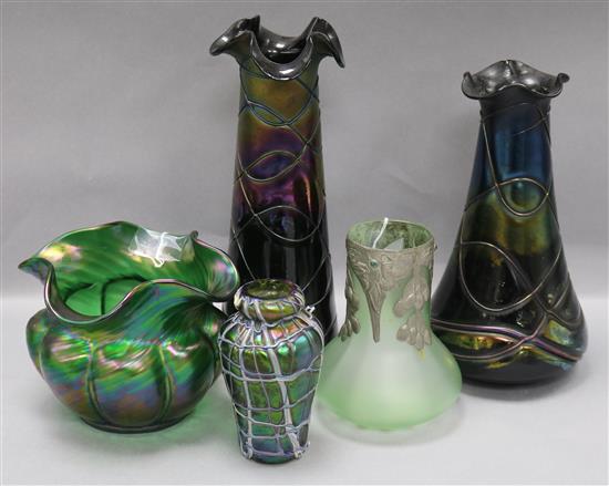 A Loetz style lobed iridescent green wavy rim vase and four other glass vases, tallest 28.5cm